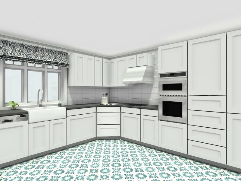 White l-shaped kitchen with blue floor tiles