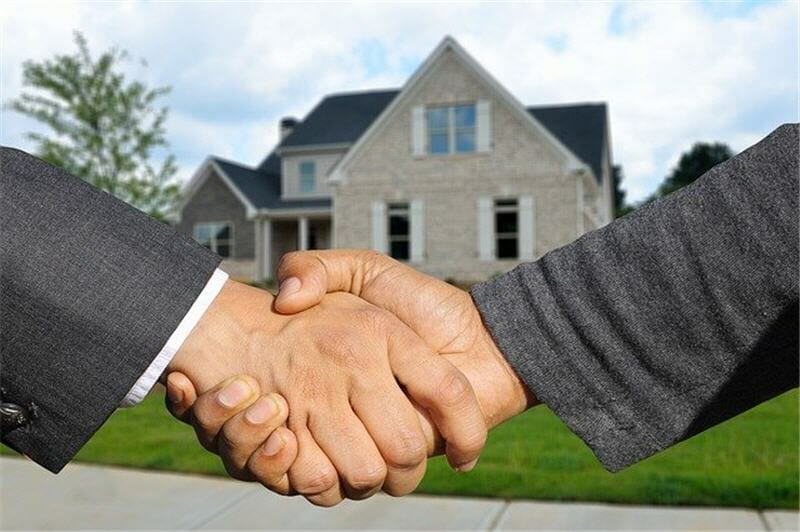 Real estate sales agreement shaking hands