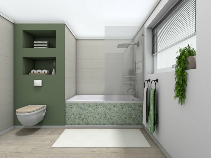 Bathroom with green accent wall and bathtub